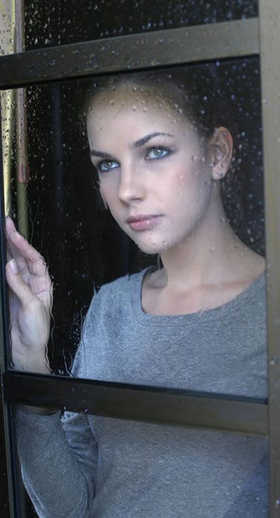 Reserved and Isolated Girl Looking Through Window