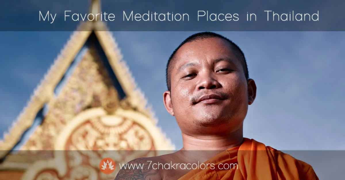 portrait of a buddhist monk standing in front of a pagoda