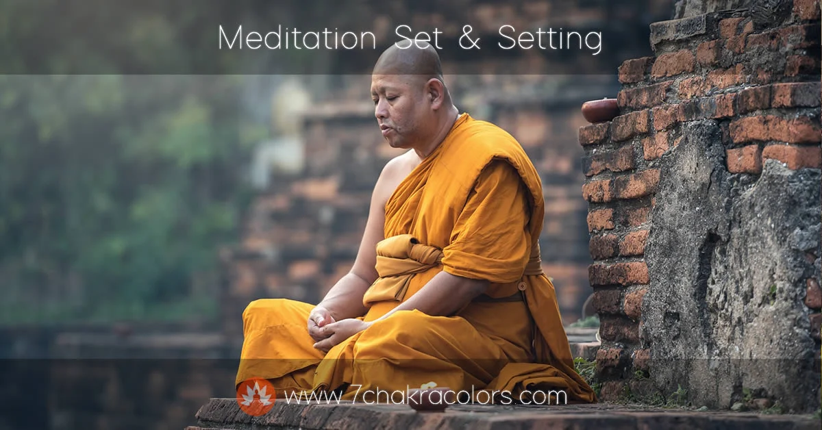 monk in yellow dress sitting in meditation pose