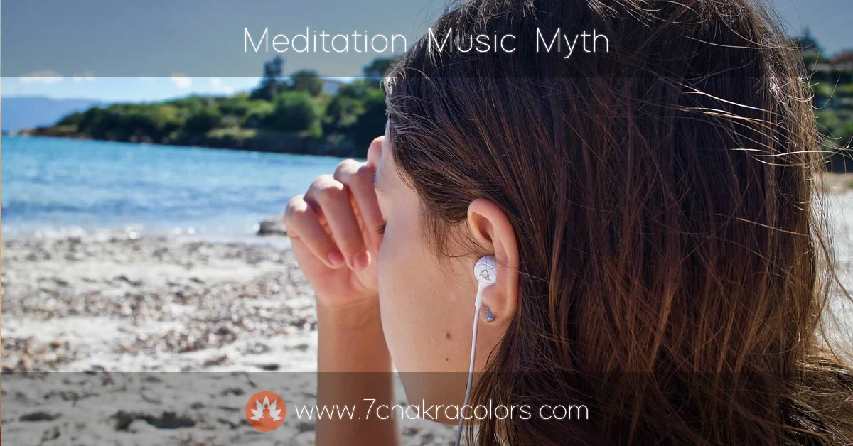 woman sitting by the sea doing pranayama exercise with earphones in her ears