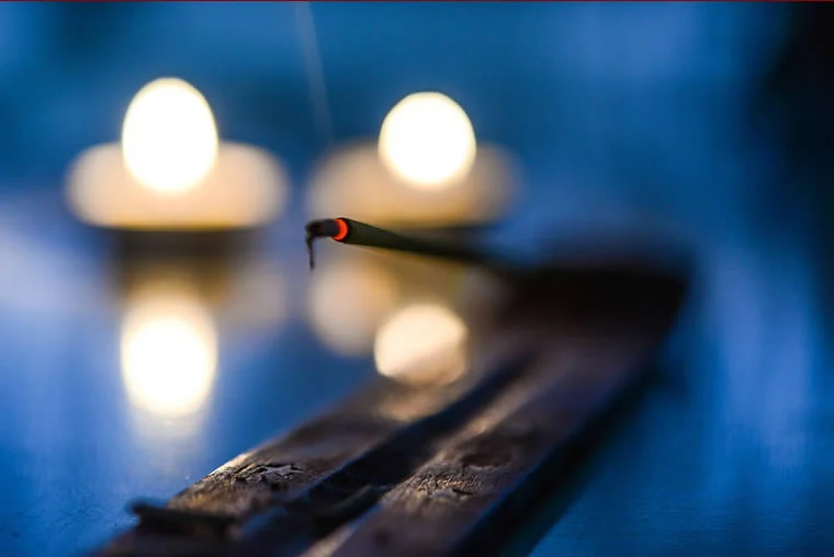 a close-up of a burning incense