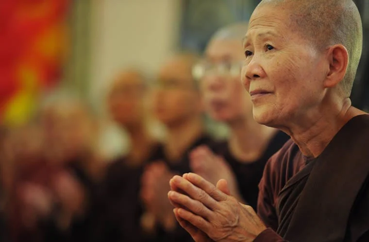 a group of people praying