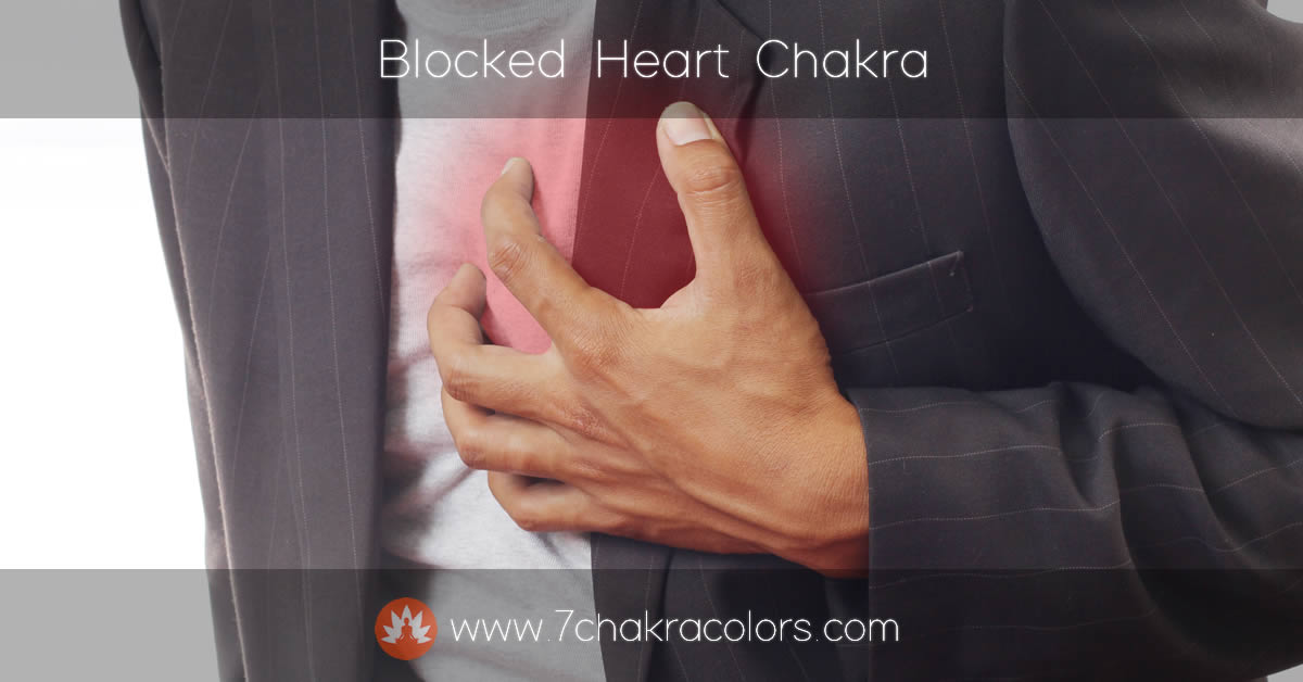 man holding his chest in pain