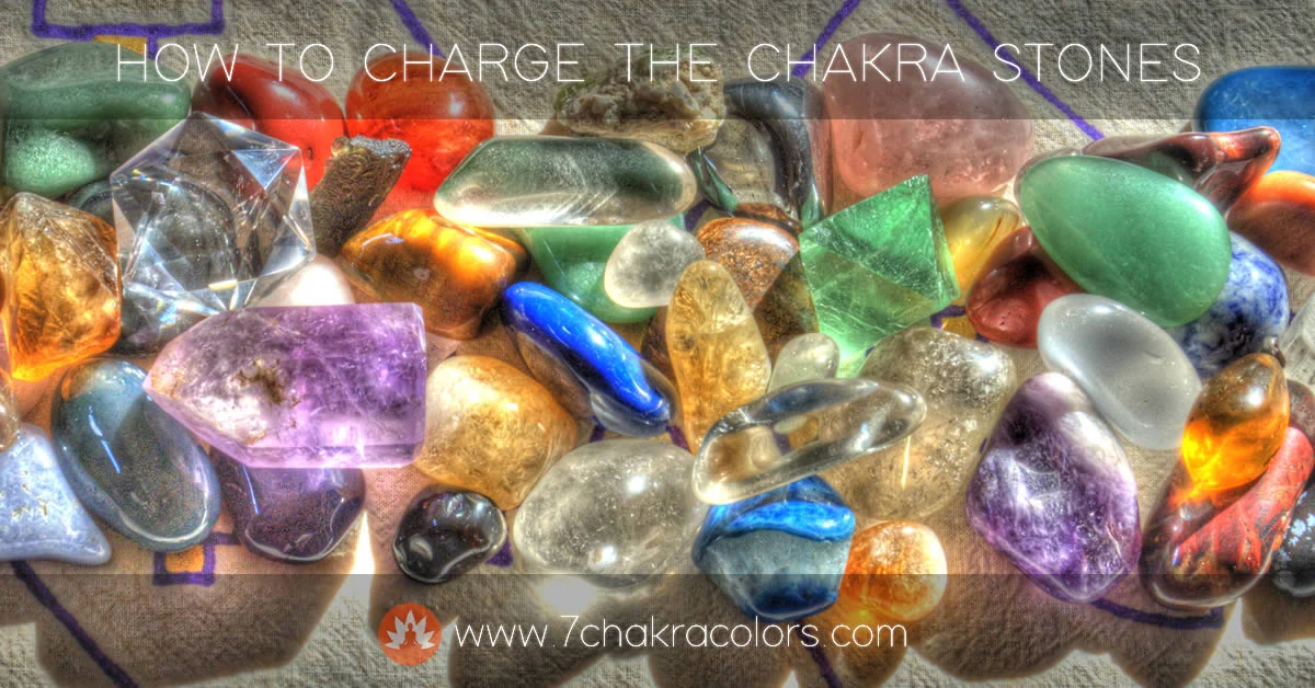 a group of different colored chakra stones and crystals