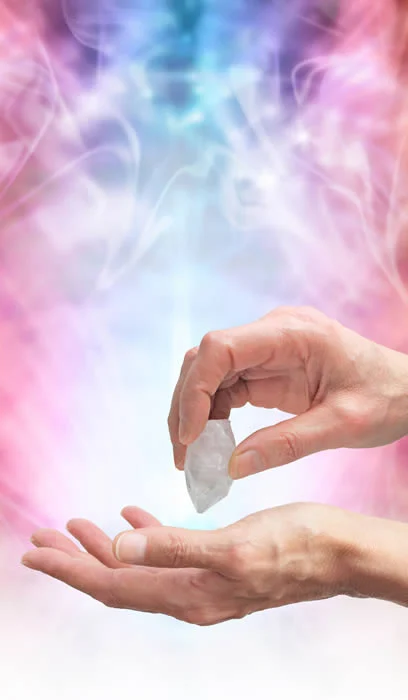 a person holding a crystal