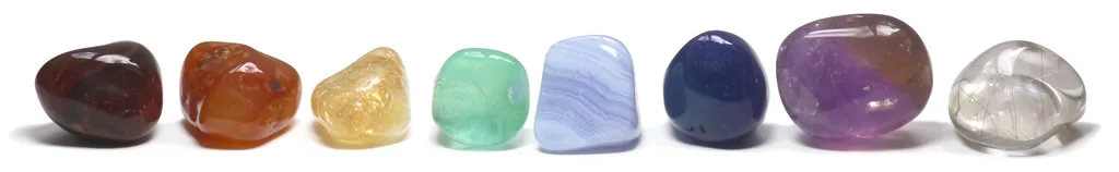 a close up of seven chakra stones