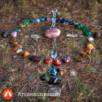 a group of colorful stones arranged in a grid on the ground
