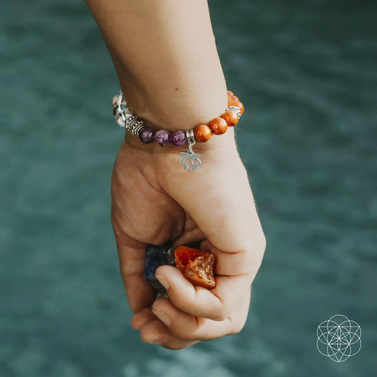 7 chakra bracelet on a womans wrist